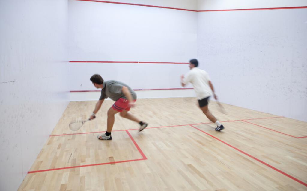 2 players on a squash cour.