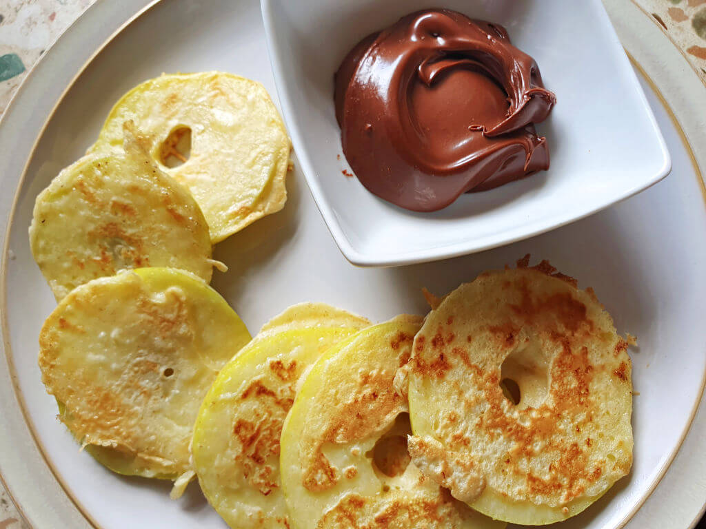 battered apple slices with dip of nutella